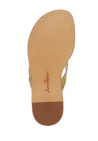 Suola del sandalo tan con bordo cucito, caratterizzata da una superficie liscia e una forma arrotondata. Nome del marchio "Sam Edelman" stampato in rosso.