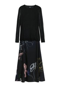 Black long-sleeve sweater paired with a black skirt featuring large, multicolored abstract floral designs.