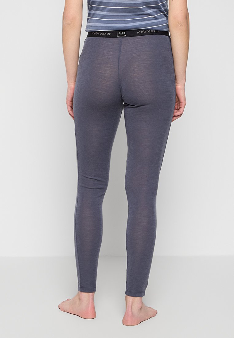Graue Leggings aus leichtem Material, mit enger Passform, elastischem Bund mit Branding und glattem, minimalistischem Design.