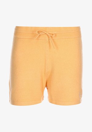 Pehmed, kudunud vabaajapüksid heledas kollases värvuses. Omab elastset vöökohta koos reguleeritava nööriga. Sile tekstuur.