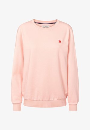 Világos rózsaszín pulóver puha anyagból, kerek nyakkivágással, hosszú ujjakkal és kis piros polo logóval a bal mellrészen.