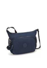 Borsa a spalla blu navy in tessuto, con apertura superiore con cerniera, tasca frontale e un charm a pompon attaccato al cursore della cerniera.