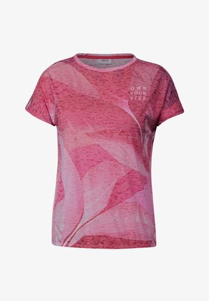 Růžové tričko s krátkým rukávem a květinovým vzorem. Materiál je hladký, na přední straně je bílé písmo "VYJÁDŘI SVOU ENERGII".