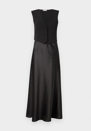 Abito nero con top senz maniche con scollatura a V profonda e tre bottoni, che si trasforma in una gonna lunga e liscia in satin.