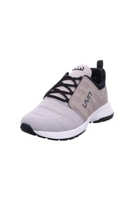 Gray athletic shoe made of textured fabric with a smooth toe cap, black accents, and a white sole. Features laces and a pull tab.