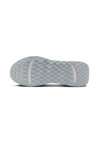 Suela de zapatilla gris claro con un patrón texturizado de puntos, que presenta un diseño flexible y una línea curva y suave como acento.