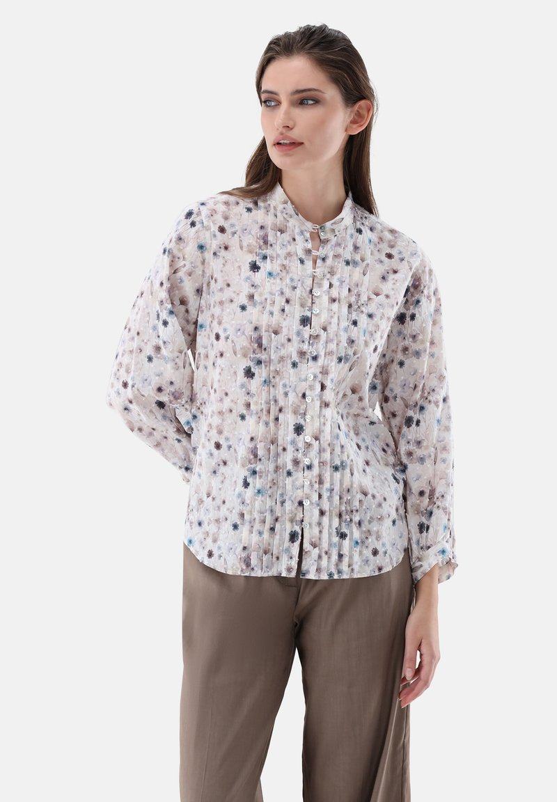 Floral button-up shirt in lightweight fabric, featuring pleats, a band collar, and a mix of purple and blue hues on a light background.