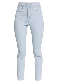 Světlé modré vysoké skinny džíny s předním zapínáním na knoflík a zip, předními a zadními kapsami a délku do kotníků.