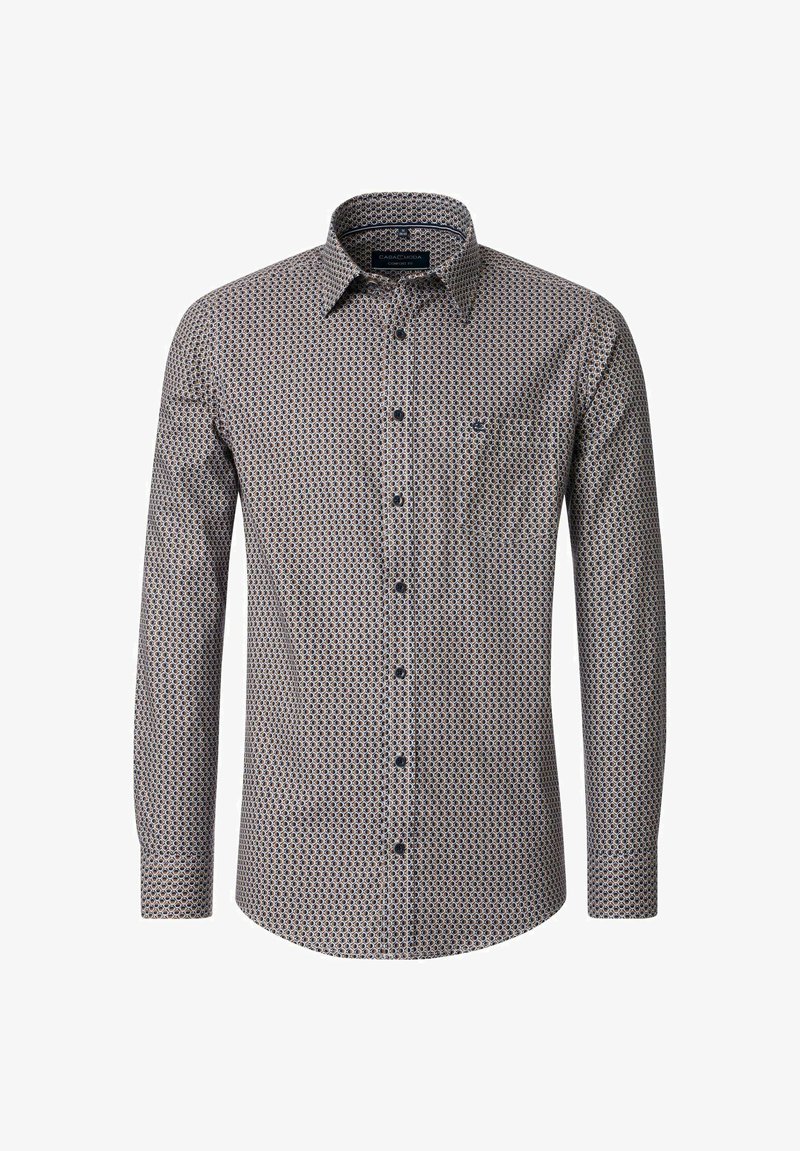 Men's long-sleeve shirt in a patterned fabric featuring dark blue and cream circles, with a pointed collar and chest pocket.