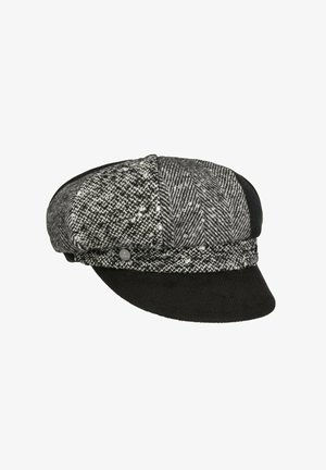 Black and gray patchwork newsboy cap with varied tweed patterns and a small metallic logo pin on the side.