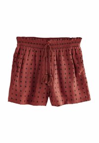 Shorts amples de couleur rouille, fabriqués en tissu léger, avec un motif en carrés noirs, une taille élastique et un détail de lien en frangé.
