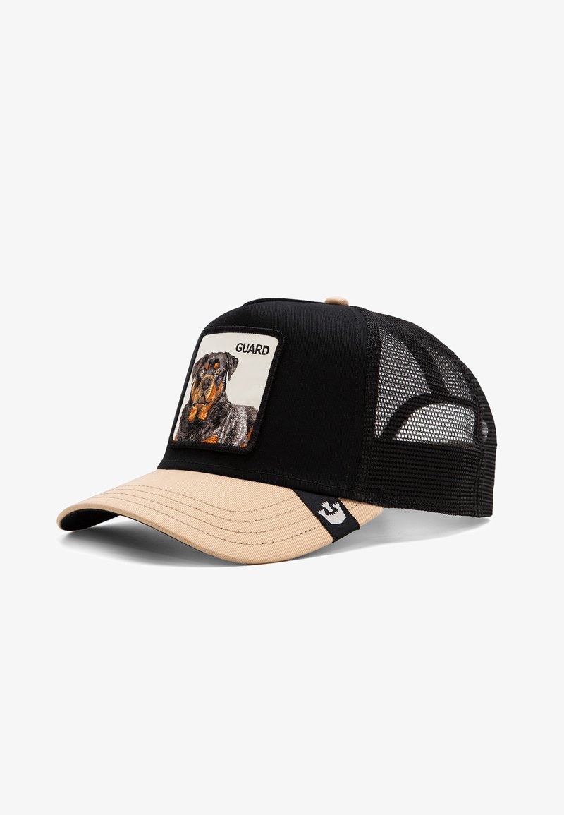 Czarny i beżowy czapka baseballowa z siateczkowym tyłem, z prostokątną łatą z wizerunkiem psa i słowem "GUARD" nad obrazkiem.