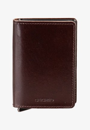 Kompakte dunkelbraune Lederbrieftasche mit sichtbaren Nähten, geprägt mit dem "SECRID" Logo und schlankem Metallkartenhalter innen.