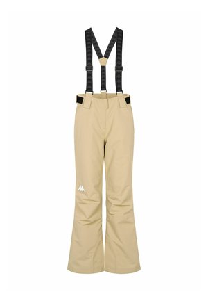 Beige skibroek met zwarte verstelbare bretels en een wit logo op de onderzijde van het linker been, ontworpen voor wintersport.