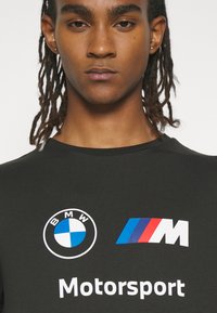 Puma LOGO TEE - Triko s potiskem - puma black