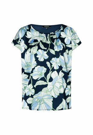 Marinebluse mit kurzen Ärmeln, die große blassblaue und grüne Blumenmuster sowie eine subtile Falte am Ausschnitt zeigt.