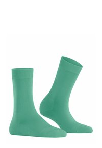 Grüne Baumwollknöchelsocken mit gerippten Bündchen, einer glatten Textur und einer klassischen Form, ausgestattet mit einer nahtlosen Zehenpartie für zusätzlichen Komfort.