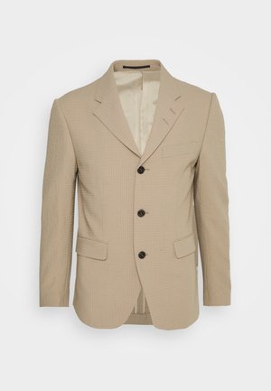 Blazer texturizado bege com lapelas recortadas, três botões, bolsos frontais e um design slim fit. Interior forrado com detalhes de costura subtis.