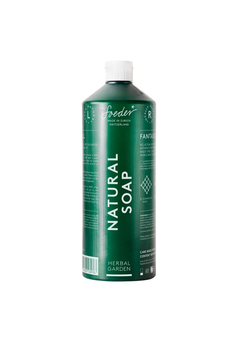Bottiglia di plastica verde contenente sapone naturale, con testo bianco e un tappo, dalla texture liscia e design minimalista. L'etichetta include informazioni sul prodotto.