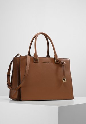 Brown leather handbag with dual top handles and a removable shoulder strap. Features a rectangular shape and a gold-tone logo plate and lock detail.