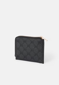 Black zippered wallet made of textured material with a raised pattern. Features gold-tone zipper and hardware, compact rectangular shape.