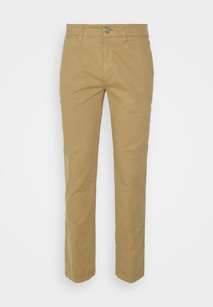 Beige bukser lavet af bomuld med lige ben-design. Har en frontlynlås, knaplukning og fem lommer, herunder baglomme.