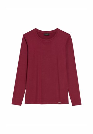 Czerwona koszulka z długim rękawem, wykonana z miękkiej bawełny. Posiada okrągły dekolt oraz małe logo w pobliżu dolnego brzegu. Gładka faktura na całej powierzchni.