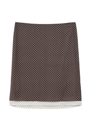 Bruine rok tot op de knie met een klein wit diamantpatroon en een witte binnenvoering die zichtbaar is bij de zoom.