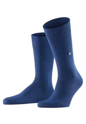 Navyblauwe katoenen sokken met ribbels aan de bovenkant, een gladde textuur en een subtiele logo-detail. Ontworpen voor comfort en duurzaamheid.