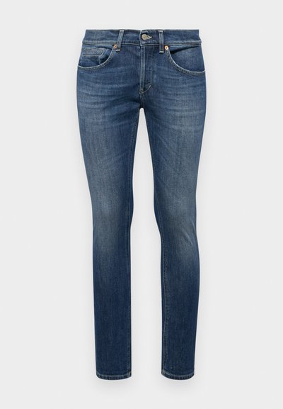 Jeans skinny in denim blu scuro. Presentano tasche frontali, una chiusura con zip e bottone, e un leggero effetto sbiadito.
