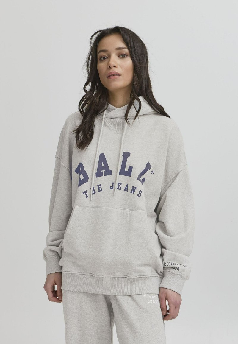 Grå bomullhettetrøye med en stor blå logo som står "BALI THE JEANS." Har en hette med snøring, lange ermer og en frontlomme.