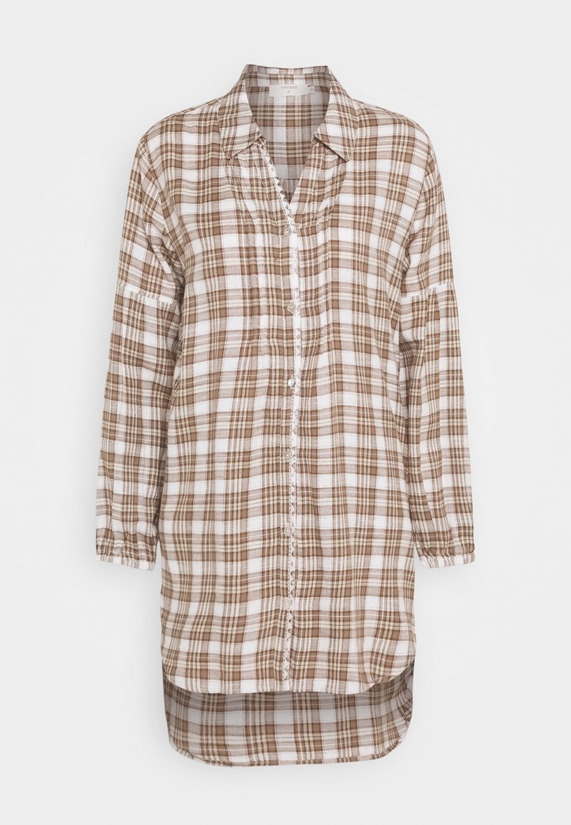 Brązowa i biała koszula w kratę z długim rękawem, zapinana na guziki, z kołnierzykiem i zaokrąglonym dołem. Posiada marszczone rękawy oraz listwę z guzikami.