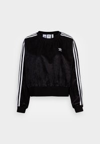 Černá krátká mikina s žebrovanou strukturou, s bílými pruhy po stranách a malým logem na hrudi. Měkká tkanina, kulatý výstřih.