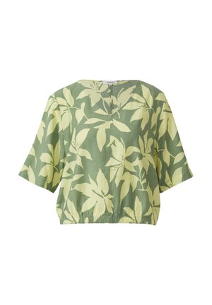 Zielona bluzka z krótkim rękawem o szerokim kroju, z elastycznym dołem i dużym, jasnokremowym wzorem kwiatowym.