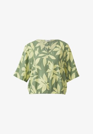 Blouse verte à manches courtes avec coupe large, ourlet élastique et grand motif floral jaune clair.