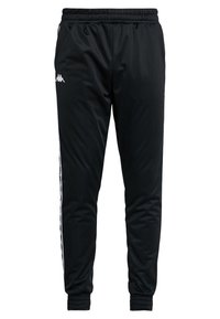 Svarta sportbyxor gjorda av slätt tyg, med ett elastiskt midjeband, smalnande ben och vita sidstripes med logotypdetaljer.