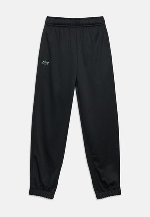 Pantalon noir à taille élastique et ourlets avec un petit logo crocodile vert sur la partie supérieure de la cuisse gauche.