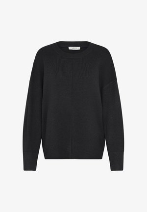 Mustad must knit-sviiter ümmarguse kaelusega, langevate õlgadega ja soonikkoes mansettidega. Omab lihtsat, ilma kaunistusteta disaini ja vabalt istuvat lõiget.