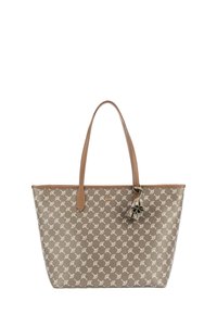 Beżowa torba jednolita z brązowymi skórzanymi uchwytami, wzorzysta tkanina z białymi wzorami oraz dekoracyjny akcent w postaci frędzli.