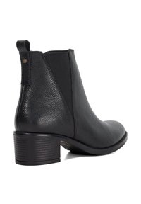 Black leather ankle boot with a textured finish, elastic side panels, and a low stacked heel, featuring a loop tab at the back for easy wear.