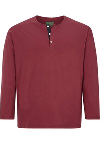 Long-sleeve burgundy shirt in soft cotton with a henley neckline, three-button placket, and a solid design without patterns or accents.