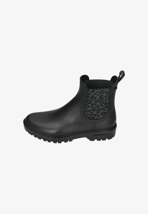Bottines Chelsea noires en caoutchouc avec un panneau latéral élastique texturé imitant un motif léopard noir et une languette pour un enfilage facile. Semelle épaisse pour une bonne adhérence.