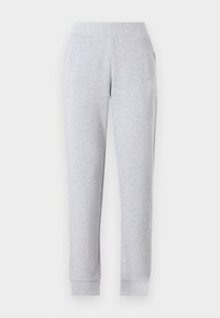 Grijze sweatpants met een taps toelopend ontwerp, elastische tailleband, ribgebreide boorden en zijzakken. De stof lijkt zacht en lichtjes gestructureerd.