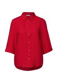 Camicia rossa con bottoni, colletto, maniche corte e vestibilità morbida. Tessuto liscio con sottili dettagli di cucitura e orlo arrotondato.