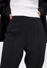 NA-KD Trousers - black