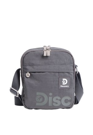 Kompakte graue Umhängetasche mit vorderer Reißverschlusstasche, verstellbarem Riemen und "Discovery"-Logo auf der Vorderseite.