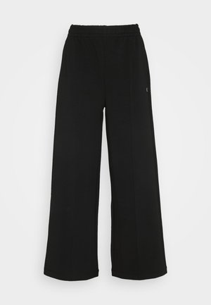 Black wide-leg pants with an elastic waistband. Made from a soft, lightweight material. Features vertical seams along the front.