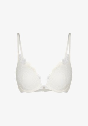 Reggiseno imbottito in pizzo bianco con bordi smerlati e sottili spalline regolabili, caratterizzato da un piccolo charm decorativo al centro anteriore.
