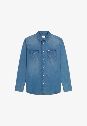 Heledsinine denimpait, millel on pikad varrukad, nööbid ees, kaks rinna taskut teravate klappidega ja dekoratiivne tikand õlgadel.