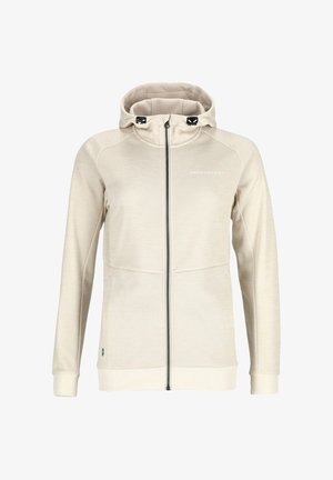 Beige vetoketjuhuppari, jossa on teksturoitu pinta, hupullinen, edessä taskut ja rintataskun logo. Ribbaat hihansuut ja helma.